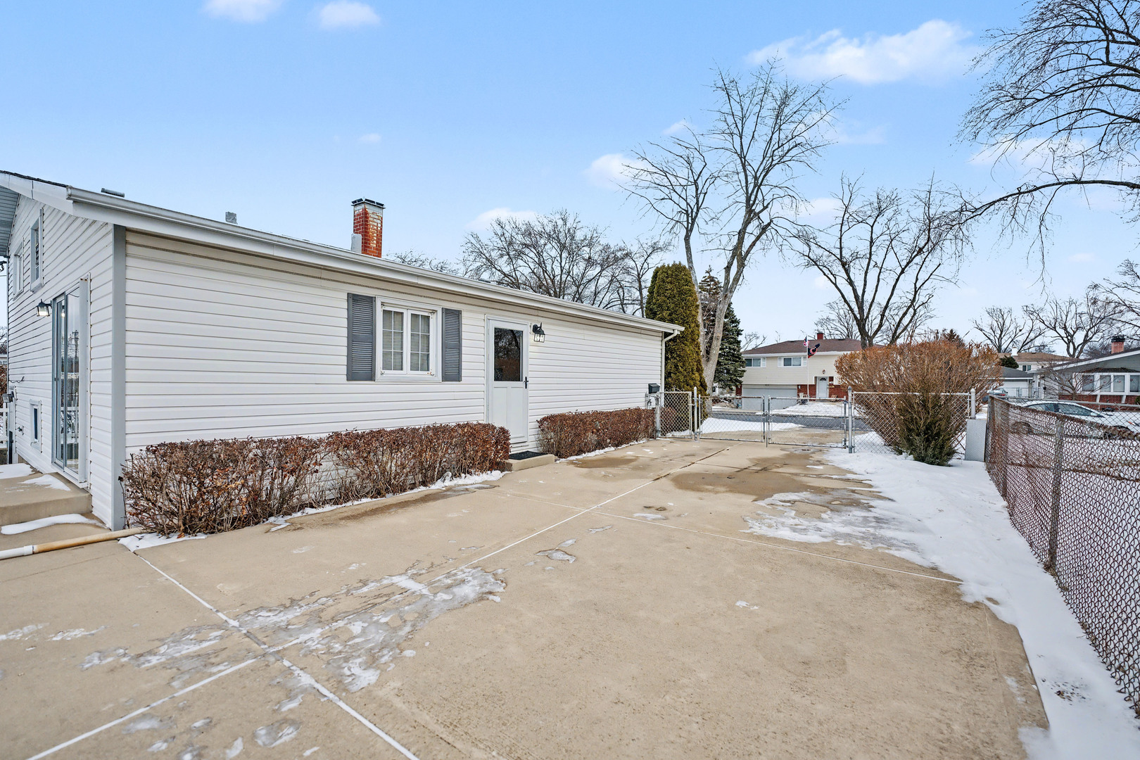 118 Evergreen Street Addison, IL 60101 - Photo 31 of 38 a view of a backyard with snow on the road