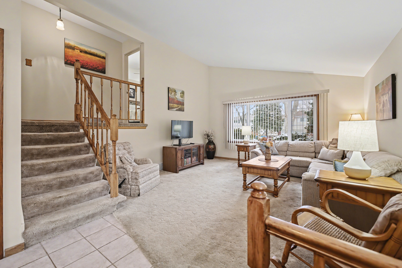 118 Evergreen Street Addison, IL 60101 - Photo 9 of 38 a view of a livingroom with furniture staircase and a living room