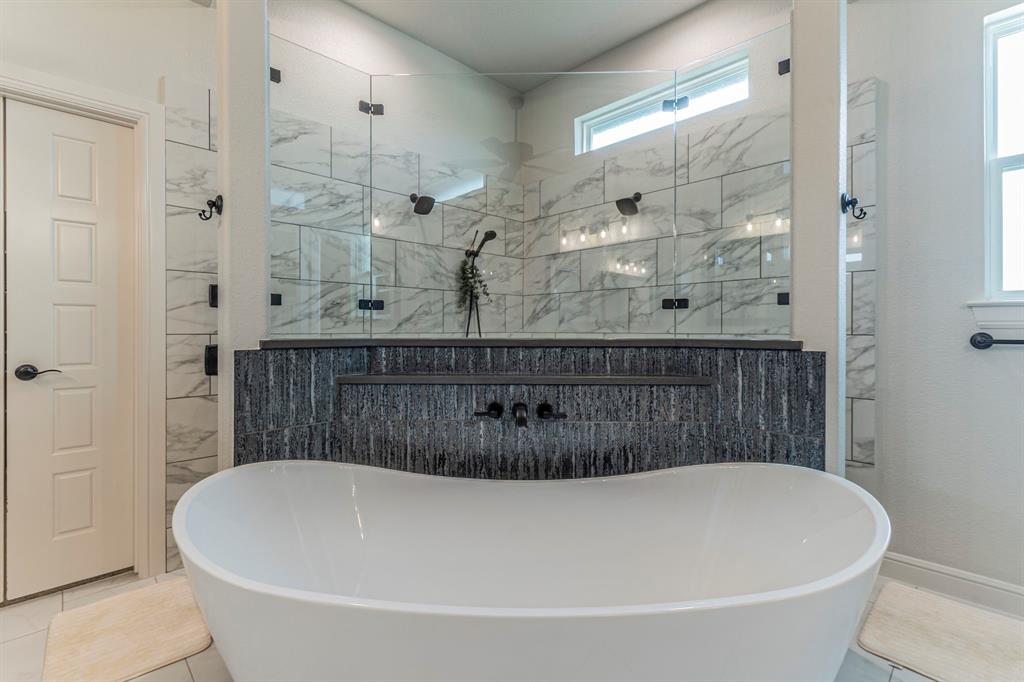 150 Las Brisas Drive Decatur, TX 76234 - Photo 14 of 33 Full bath featuring a freestanding bath, light tile patterned floors, and a stall shower