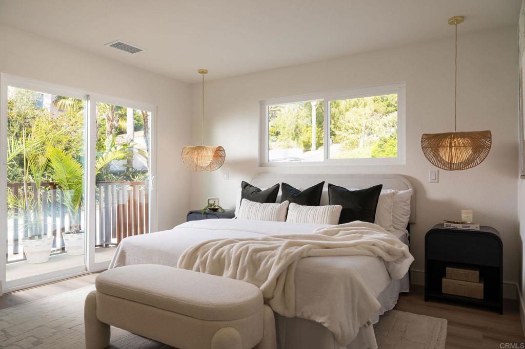 1551 Burgundy Road Encinitas, CA 92024 - Photo 16 of 45 a bedroom with bed and a window