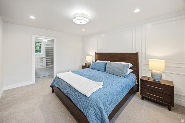 1774 Country Club Drive Logan, UT 84321 - Photo 11 of 28 Carpeted room with recessed lighting and a decorative ceiling fixture, featuring a wall with applied molding