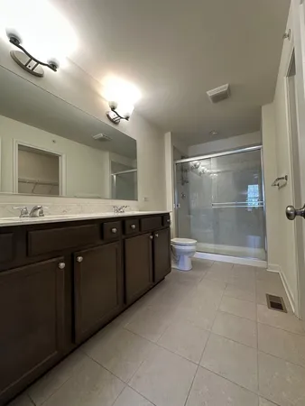 a bathroom with a granite countertop sink mirror and bathtub