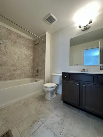 a bathroom with a sink a toilet and a bathtub