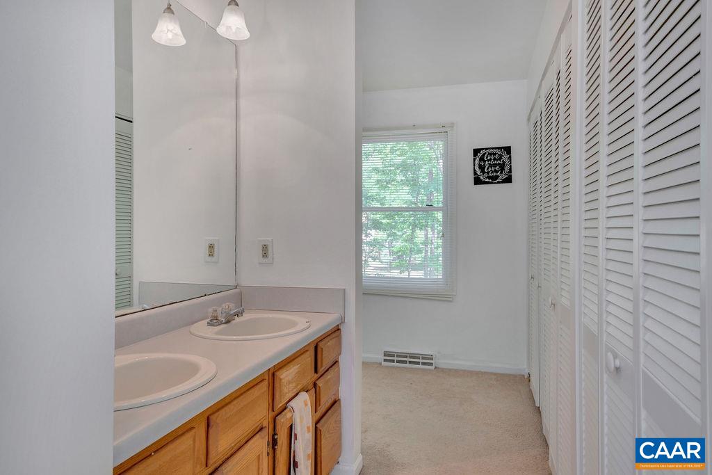 18 Laguna Road Palmyra, VA 22963 - Photo 14 of 34 a bathroom with a sink and a mirror