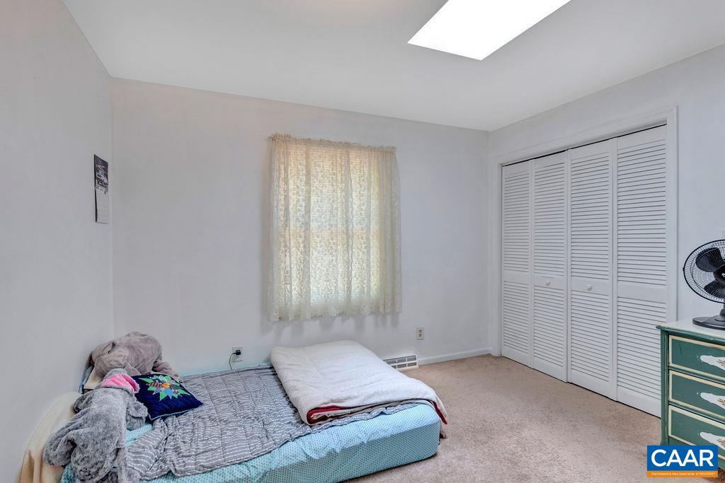 18 Laguna Road Palmyra, VA 22963 - Photo 19 of 34 a bedroom with a bed and a window