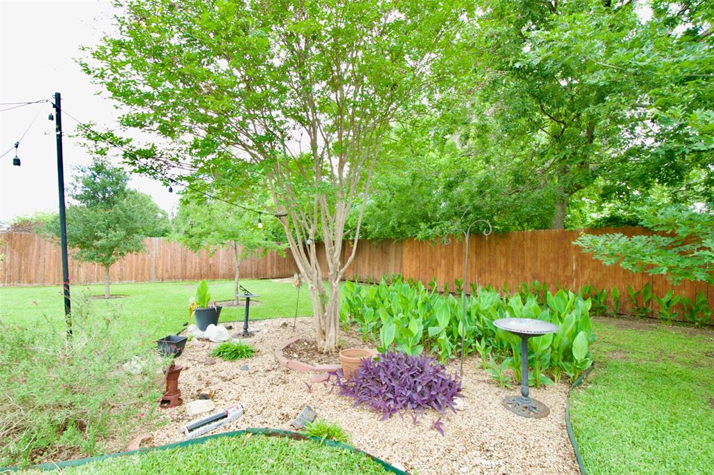 1307 North 65th Street Waco, TX 76710 - Photo 33 of 35 a view of a garden with a lake