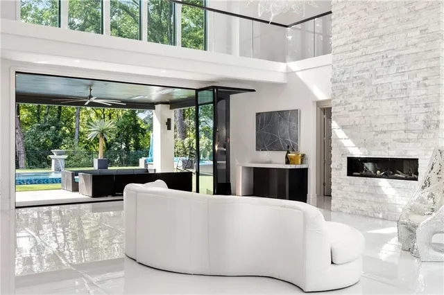 a kitchen with stainless steel appliances kitchen island granite countertop a table and chairs