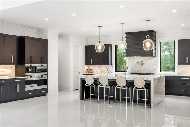 a spacious bedroom with a bed and dresser