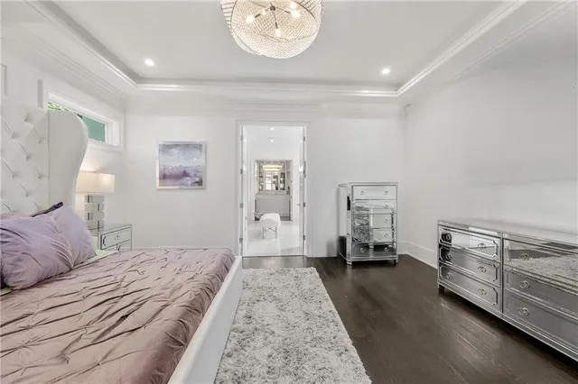 a spacious bathroom with a vanity mirror and a bathtub
