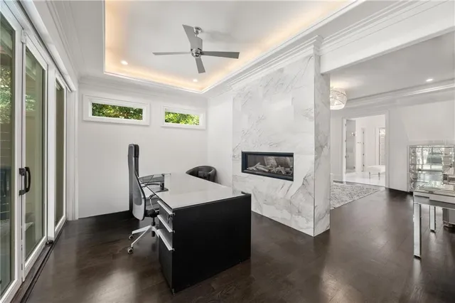 a bedroom with a large bed and wooden floor