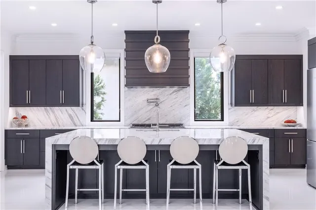 a view of a house with potted plants