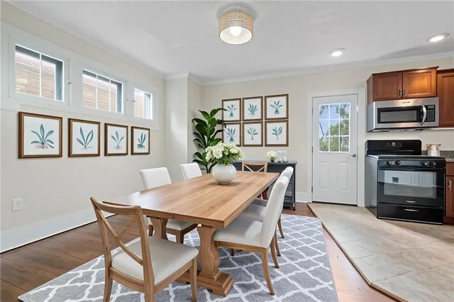 a view of a dining room with furniture window and wooden floor