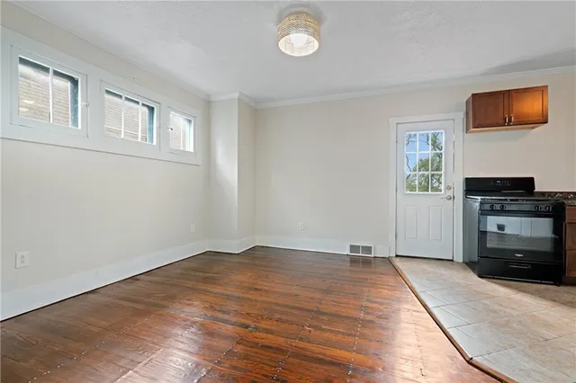 a view of an empty room with a flat screen tv