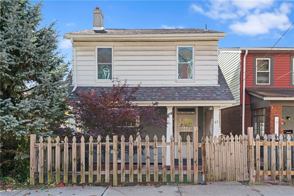 67 Semicir Street Pittsburgh, PA 15214 - Photo 2 of 36 a front view of a house with a garden