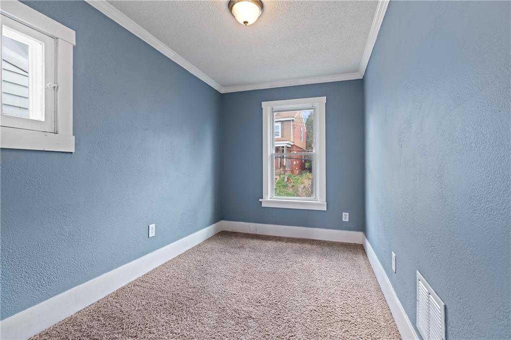 67 Semicir Street Pittsburgh, PA 15214 - Photo 24 of 36 an empty room with windows