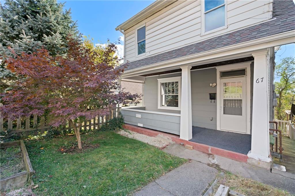 67 Semicir Street Pittsburgh, PA 15214 - Photo 3 of 36 a front view of a house with a garden