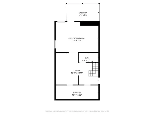 a picture of a bench in front of a wall