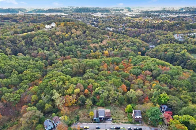an aerial view of city and lake