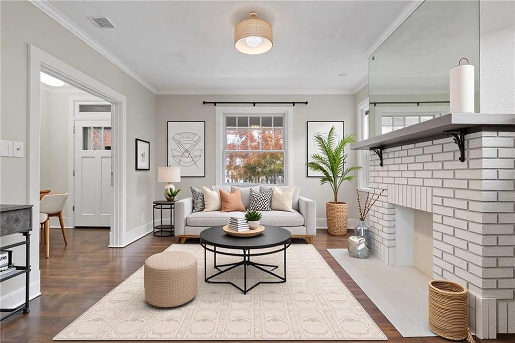 67 Semicir Street Pittsburgh, PA 15214 - Photo 8 of 36 a living room with furniture potted plant and a fireplace
