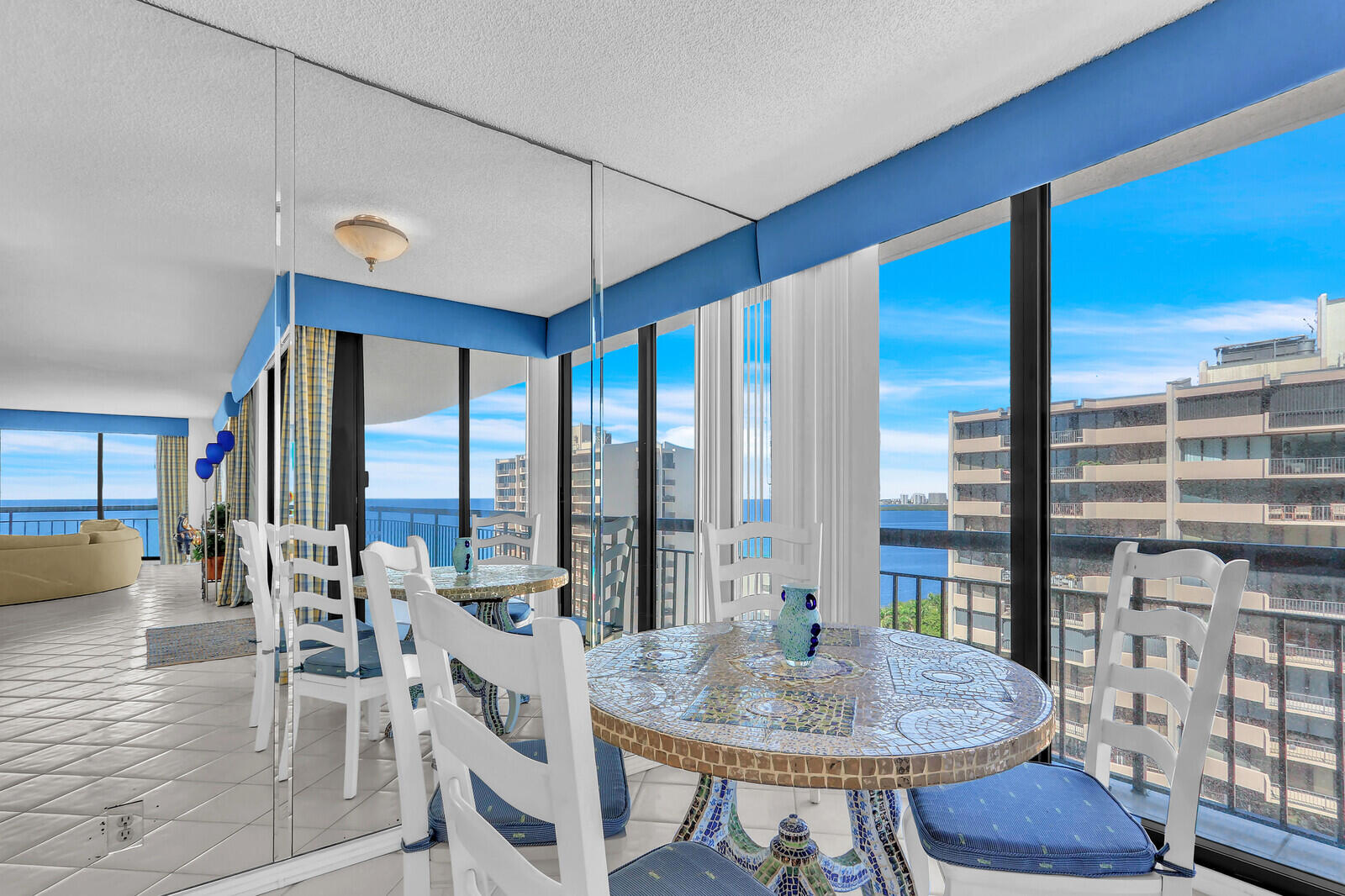 4100 North Ocean Drive, Unit 1501 Singer Island, FL 33404 - Photo 11 of 37 a view of a dining room with furniture window and wooden floor