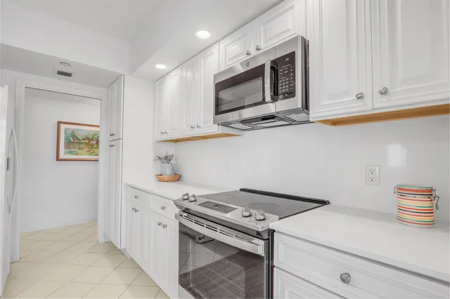 a kitchen with a stove microwave and sink