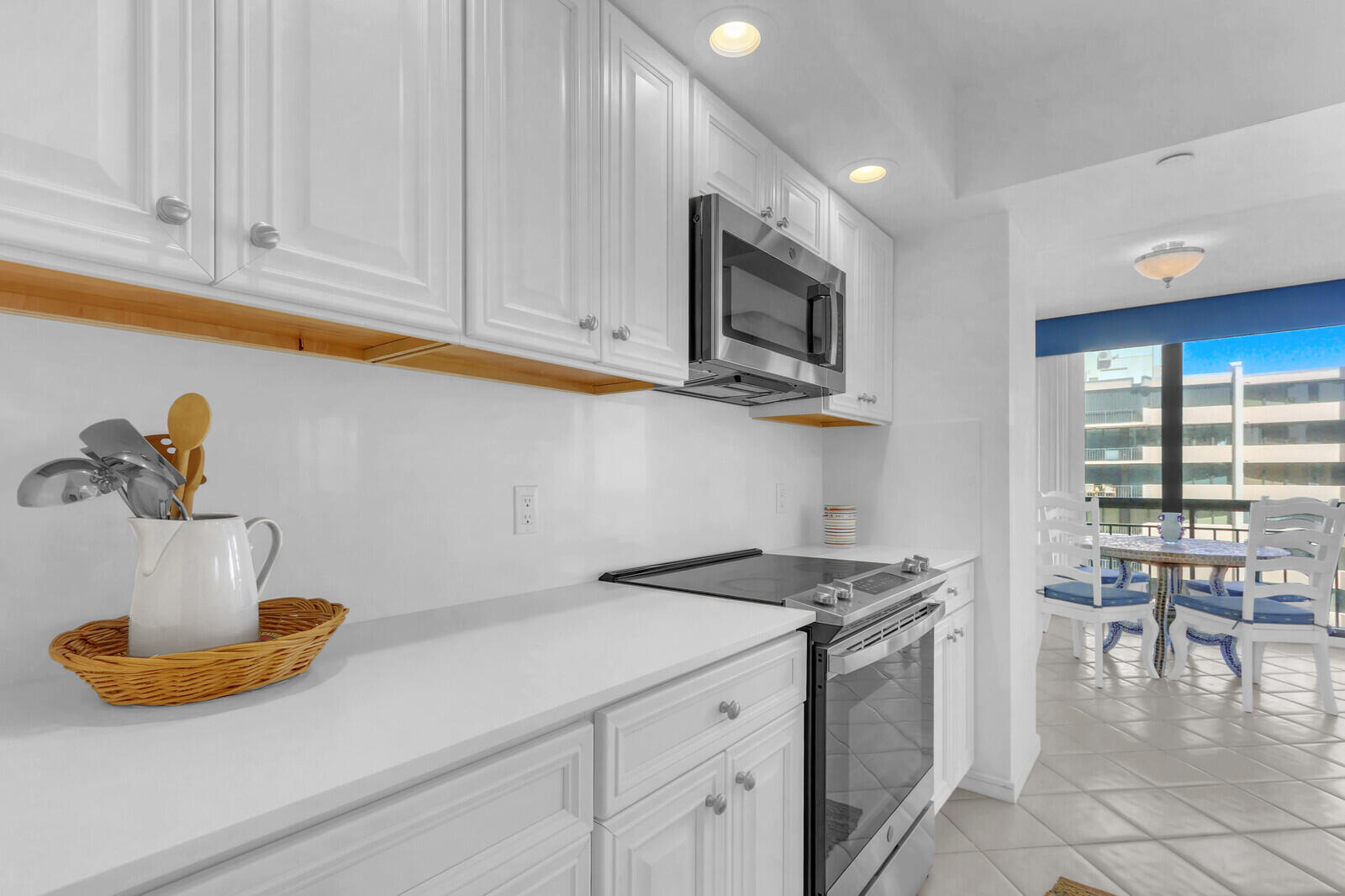 4100 North Ocean Drive, Unit 1501 Singer Island, FL 33404 - Photo 14 of 37 a kitchen with stainless steel appliances granite countertop a sink a stove and cabinets