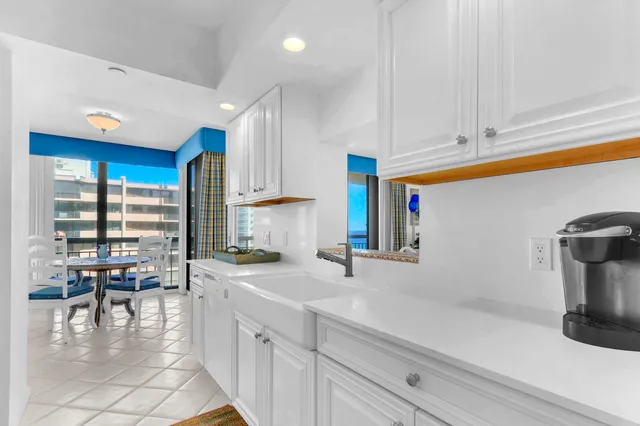 a kitchen with sink cabinets and outdoor view