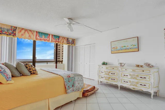 a bedroom with bed and window