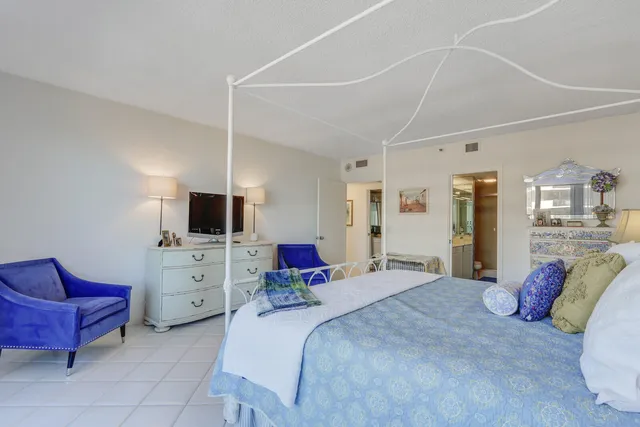 a bedroom with a bed and furniture