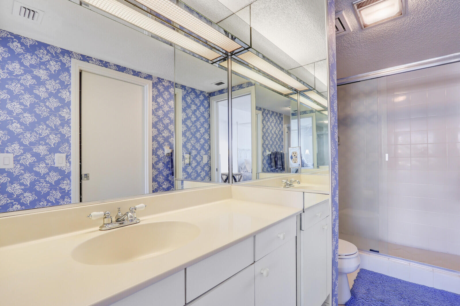 4100 North Ocean Drive, Unit 1501 Singer Island, FL 33404 - Photo 33 of 37 a bathroom with a granite countertop sink toilet and shower