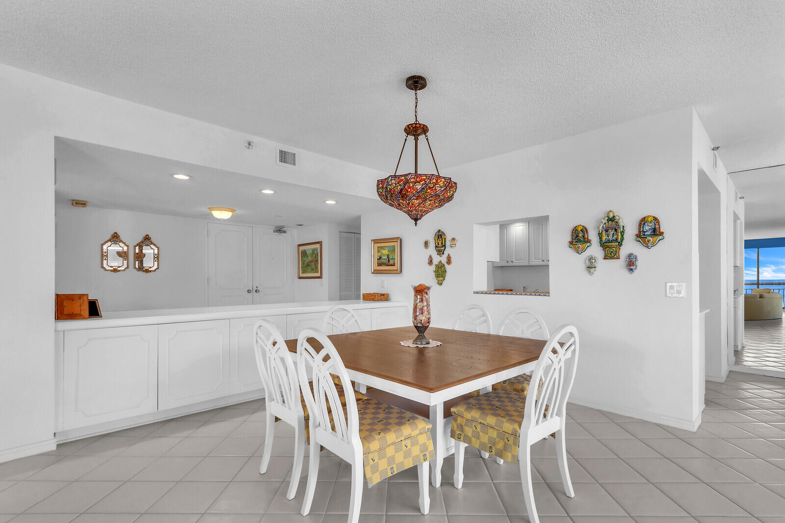 4100 North Ocean Drive, Unit 1501 Singer Island, FL 33404 - Photo 7 of 37 a dining room with a table and chairs