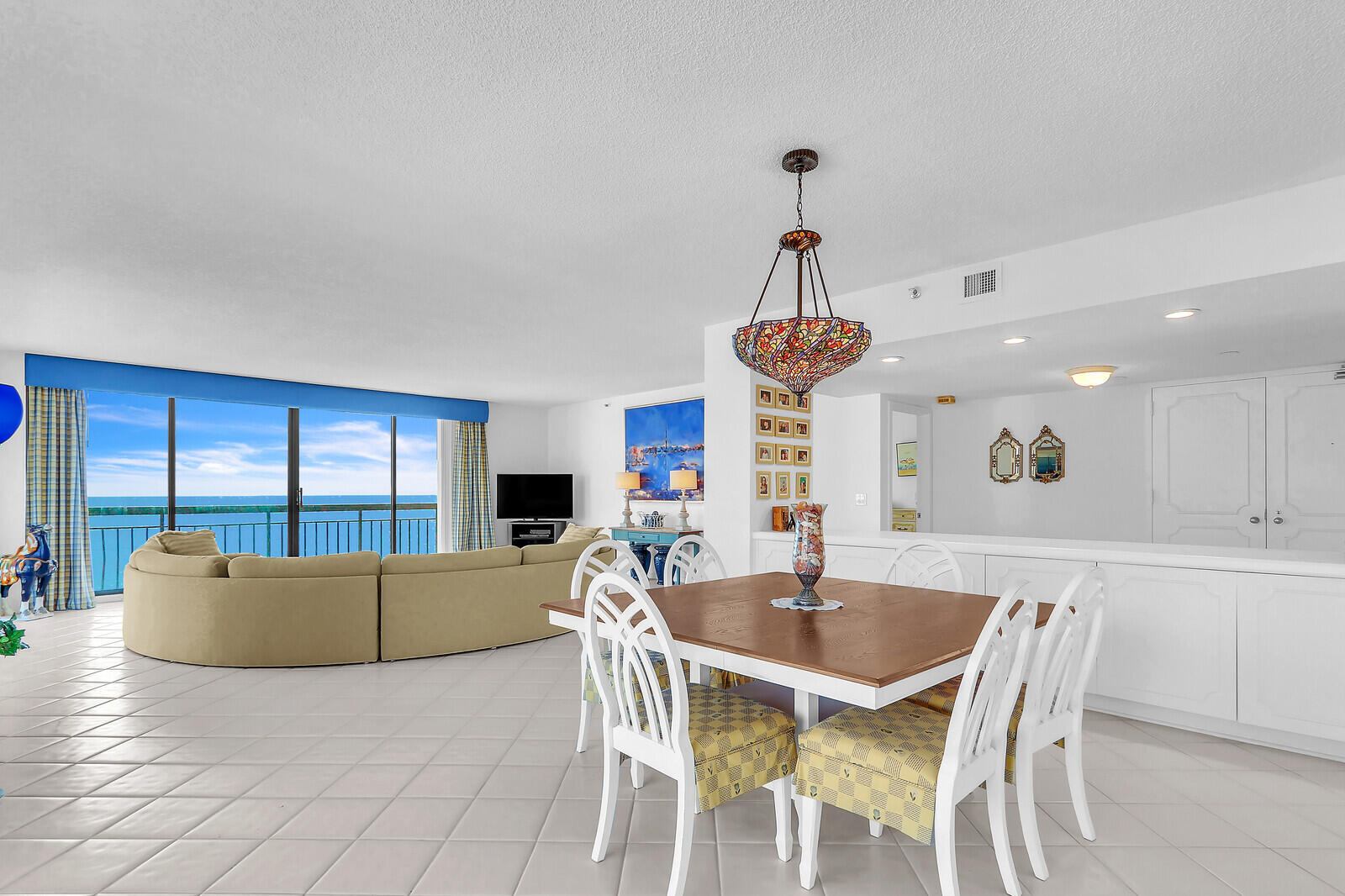 4100 North Ocean Drive, Unit 1501 Singer Island, FL 33404 - Photo 9 of 37 a view of a dining room with furniture window and outside view