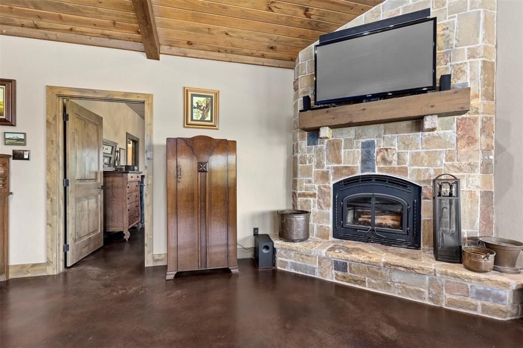 5555 Wright Road Sherman, TX 75092 - Photo 13 of 40 a living room with furniture and a fireplace