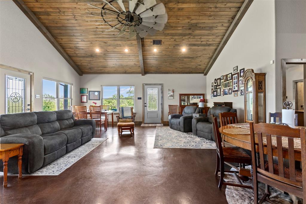 5555 Wright Road Sherman, TX 75092 - Photo 14 of 40 a living room with furniture and a chandelier