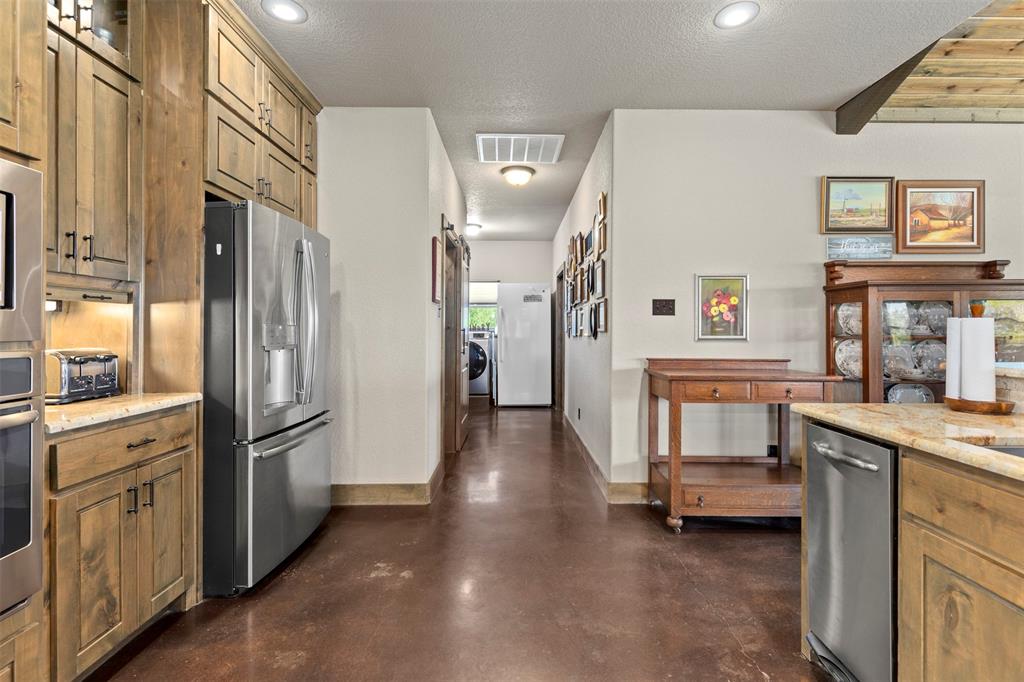 5555 Wright Road Sherman, TX 75092 - Photo 20 of 40 a kitchen with a refrigerator and a sink