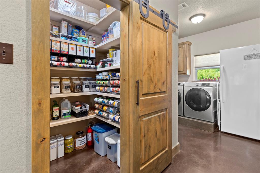 5555 Wright Road Sherman, TX 75092 - Photo 21 of 40 a view of walk in closet and utility room