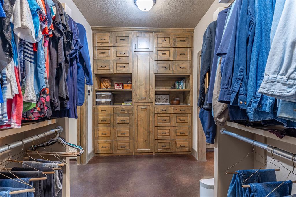 5555 Wright Road Sherman, TX 75092 - Photo 25 of 40 a view of walk in closet with clothes