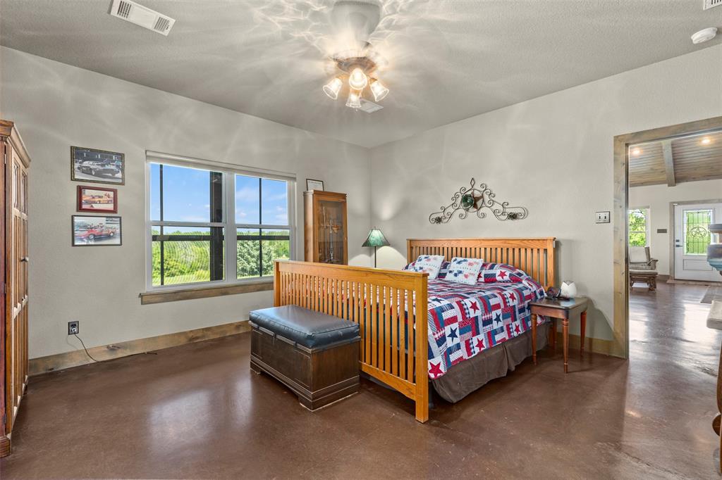 5555 Wright Road Sherman, TX 75092 - Photo 28 of 40 a bed room with a bed and a couch