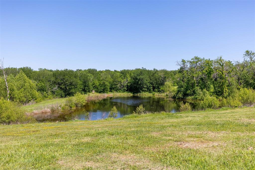 5555 Wright Road Sherman, TX 75092 - Photo 39 of 40 a view of a lake with houses in the back