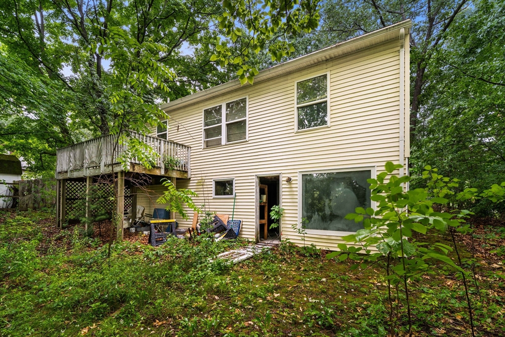 7 Upland Road Natick, MA 01760 - Photo 13 of 15 a front view of a house with a garden
