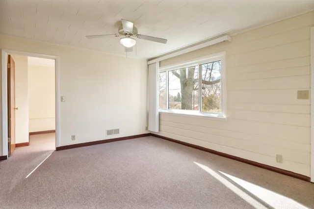 a view of an empty room and window