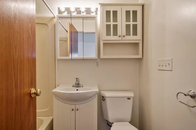 a bathroom with a bathtub and a sink