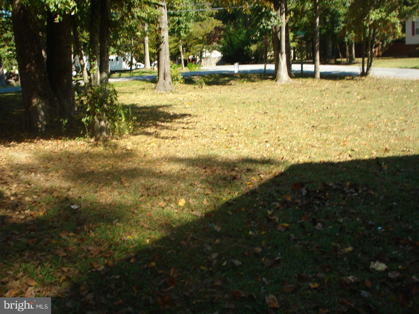 11305 Commanche Road Lusby, MD 20657 - Photo 22 of 27 a view of a yard with swimming pool
