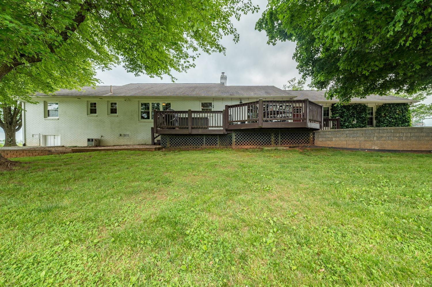 2901 Goode Station Road Goode, VA 24556 - Photo 16 of 57 a view of a house with a yard balcony and sitting area