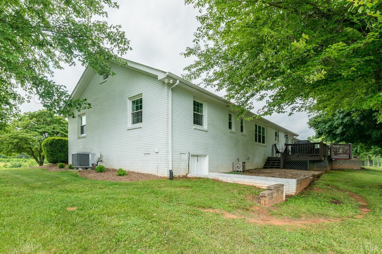 2901 Goode Station Road Goode, VA 24556 - Photo 20 of 57 a view of backyard with a garden and trees