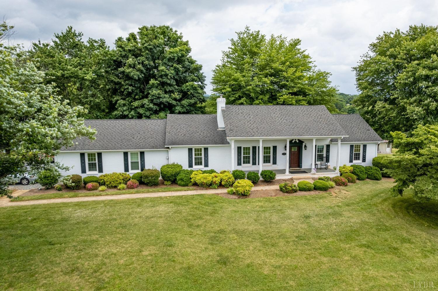 2901 Goode Station Road Goode, VA 24556 - Photo 24 of 57 a front view of a house with a yard and trees