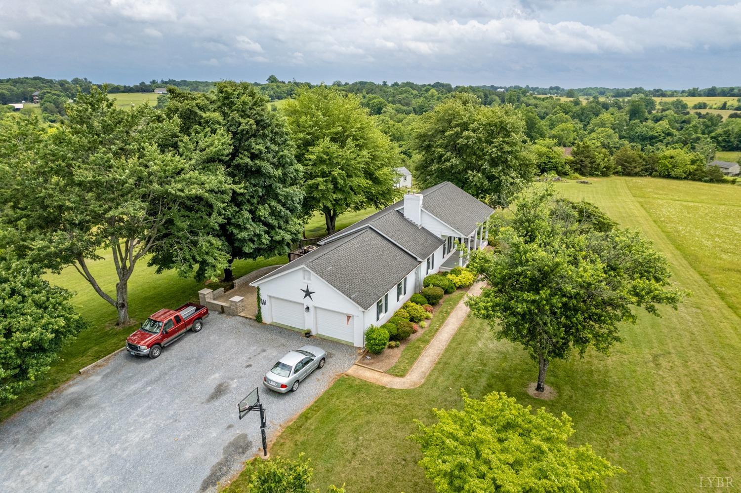 2901 Goode Station Road Goode, VA 24556 - Photo 27 of 57 an aerial view of a house with a yard basket ball court and outdoor seating