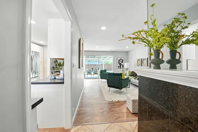a view of a living room and a dining room with furniture