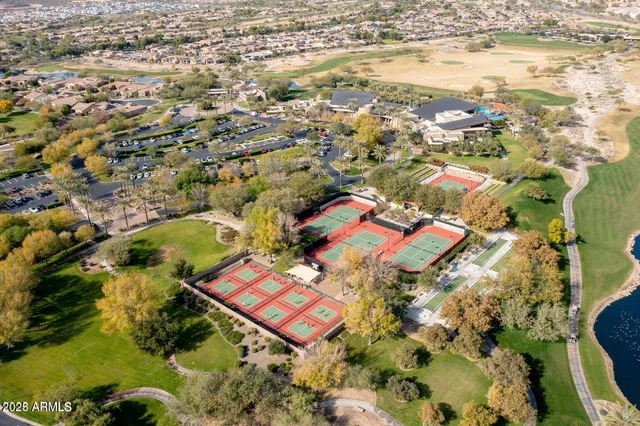 a view of a swimming pool with an outdoor seating