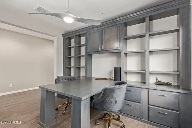 a view of a workspace with furniture